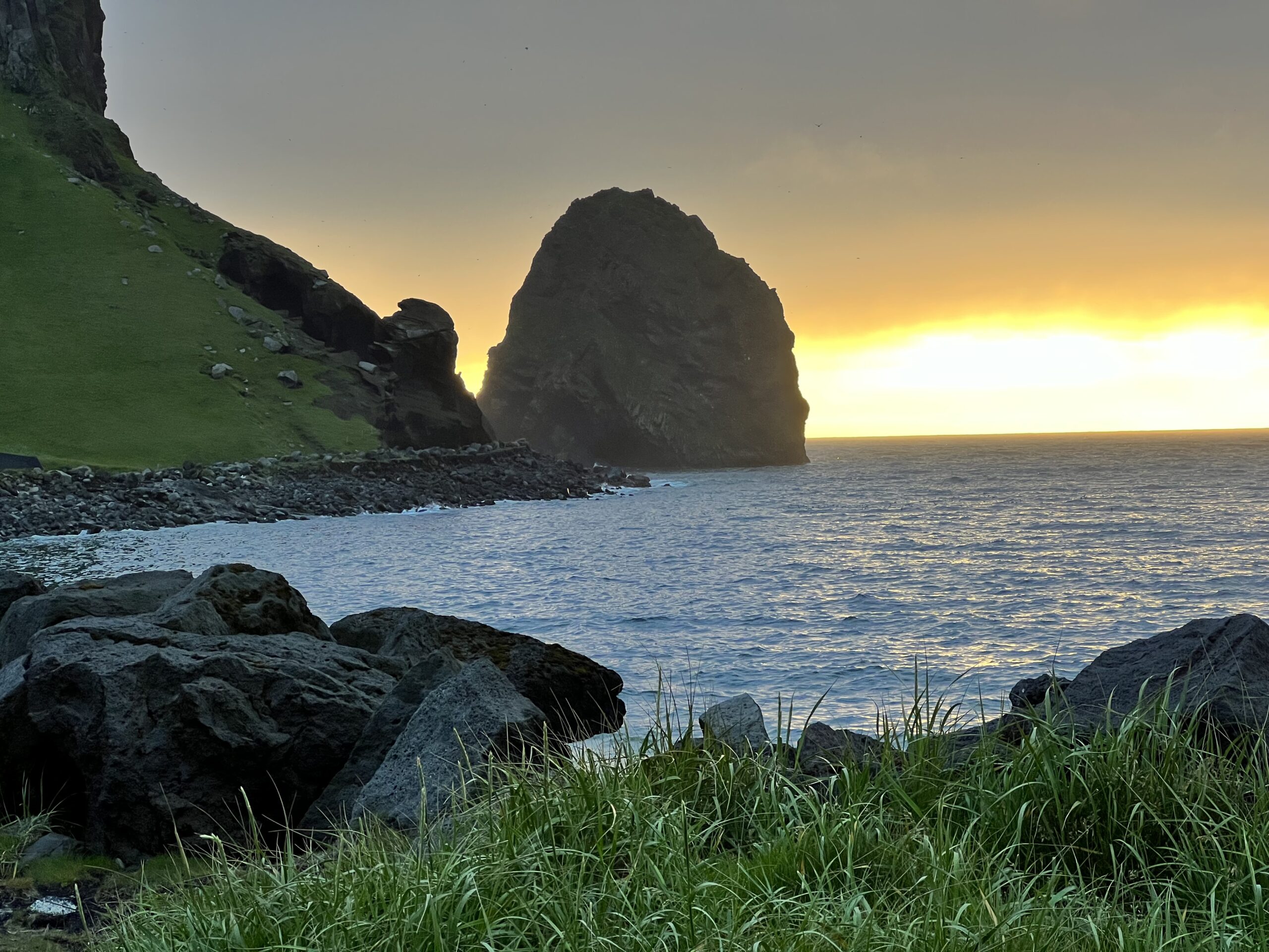 a sunset from the coast of Heimaey